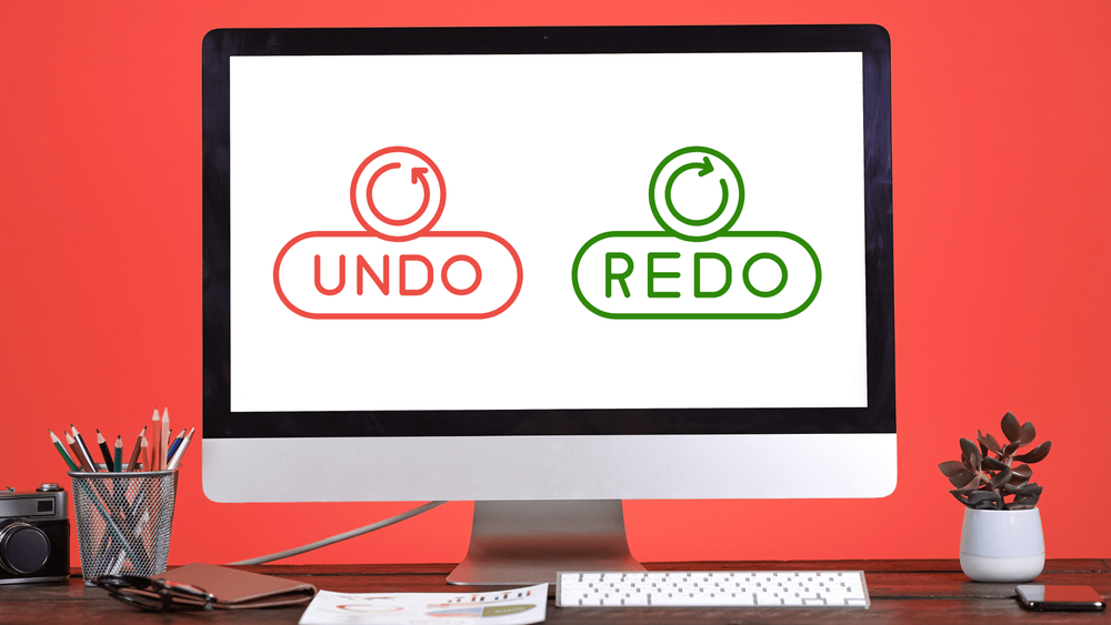 Undo and redo shortcut icons on a computer with a red background