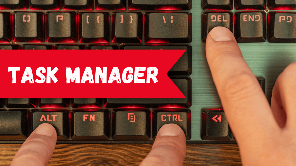 Fingers pressing the Ctrl+Alt+Delete keys on a red RGB keyboard, with a banner with the text "TASK MANAGER" on top, representing the Task Manager shortcut
